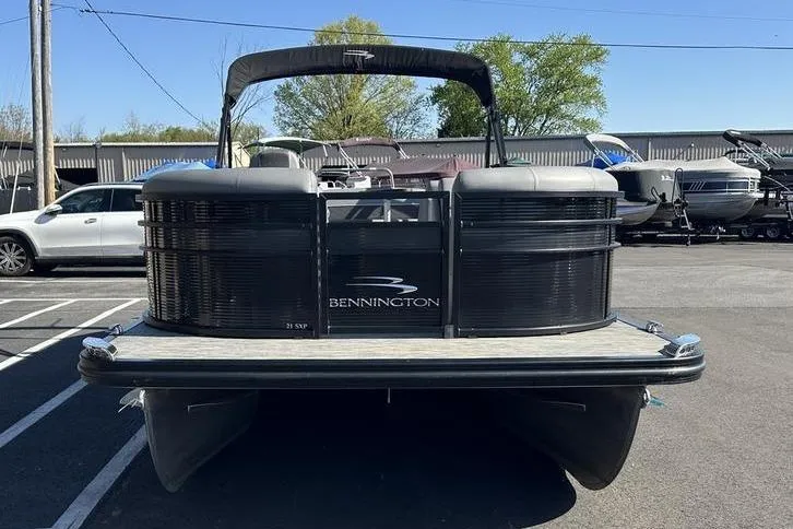 Slide: The Image of 2020 Bennington 21 SSBXP pontoon boat parked in a lot, front view. - 6