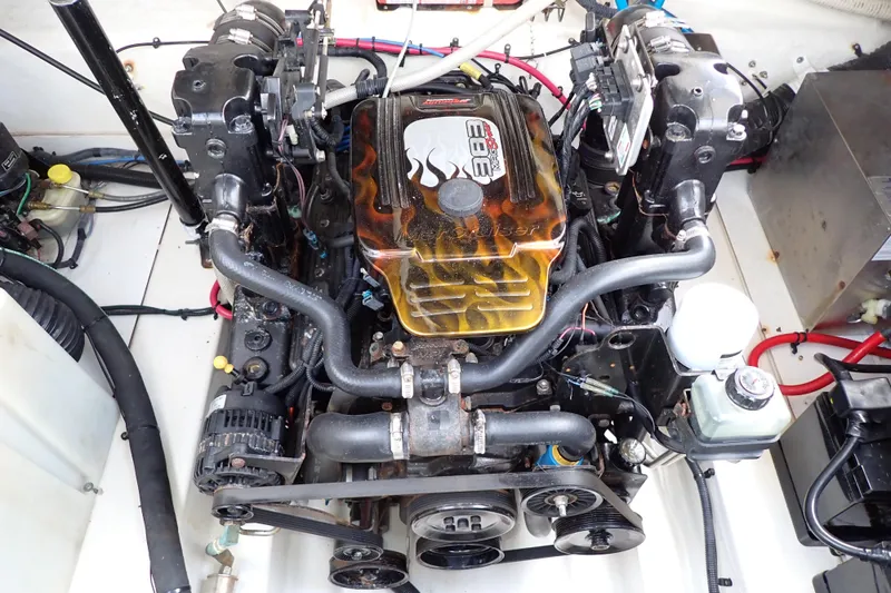 Slide: The Image of Engine compartment of a 2005 Sea Ray Sundancer 260 boat, featuring a detailed engine view. - 101