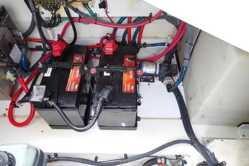 Slide: The Image of Electrical system of a 2005 Sea Ray Sundancer 260 boat, featuring dual batteries and wiring. - 105