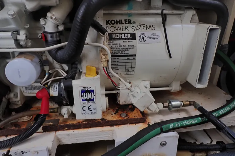 Slide: The Image of Engine compartment of a 2005 Sea Ray Sundancer 260 with Kohler power systems. - 106