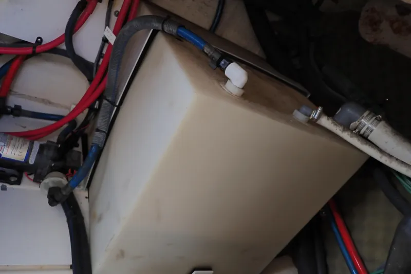 Slide: The Image of 2005 Sea Ray Sundancer 260 boat interior showing plumbing and wiring components. - 108