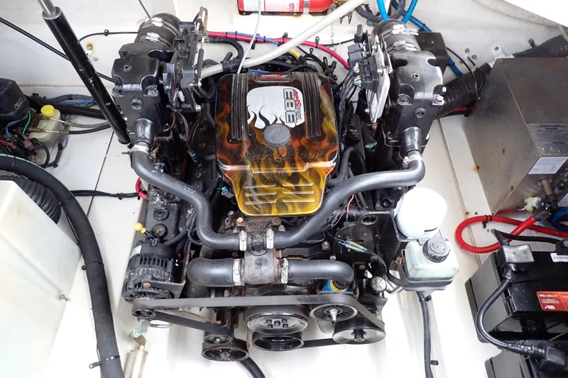 Slide: The Image of Engine compartment of a 2005 Sea Ray Sundancer 260 boat, featuring a detailed engine view. - 111
