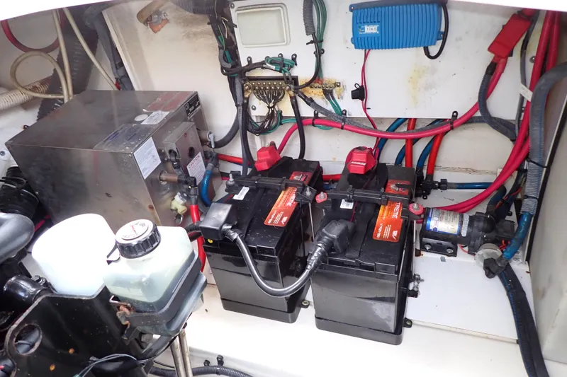 Slide: The Image of Engine compartment of 2005 Sea Ray Sundancer 260 with batteries and wiring. - 115