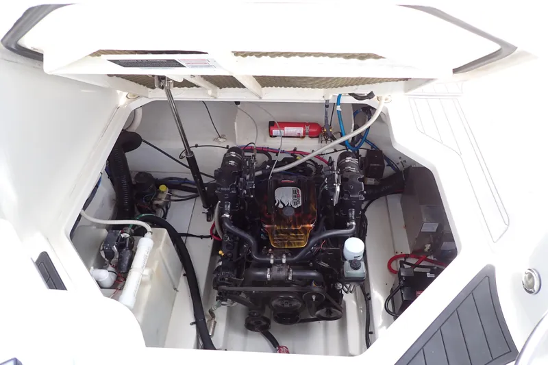 Slide: The Image of Engine compartment of a 2005 Sea Ray Sundancer 260 boat, showcasing mechanical components. - 118