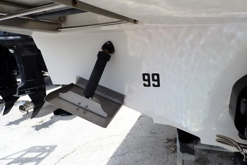 Slide: The Image of Rear view of a 2005 Sea Ray Sundancer 260 boat with trim tab and propeller. - 124