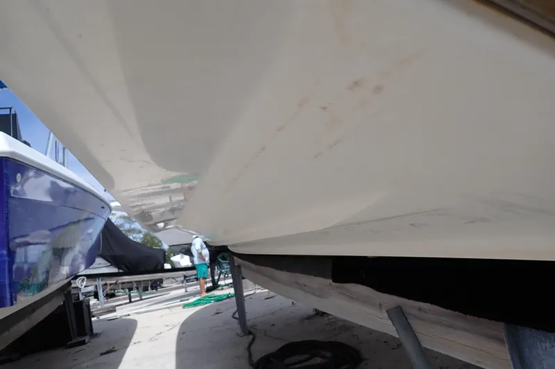 Slide: The Image of 2005 Sea Ray Sundancer 260 boat hull on dry dock, side view. - 125