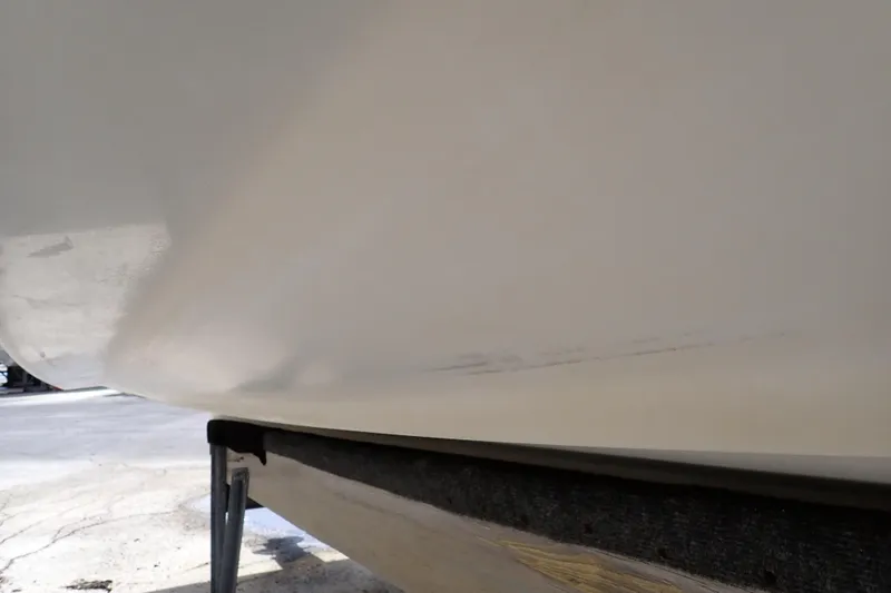 Slide: The Image of 2005 Sea Ray Sundancer 260 hull on trailer, showing minor scuff marks. - 131