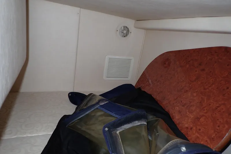 Slide: The Image of Interior cabin of 2005 Sea Ray Sundancer 260 with storage and ventilation. - 14