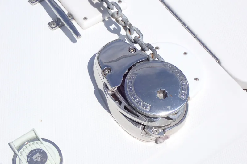 Slide: The Image of Windlass on 2005 Sea Ray Sundancer 260 boat deck, featuring polished metal finish. - 23