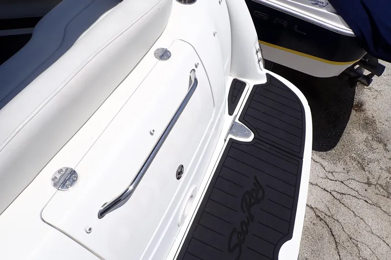 Slide: The Image of 2005 Sea Ray Sundancer 260 swim platform with sleek design and Sea Ray logo. - 28