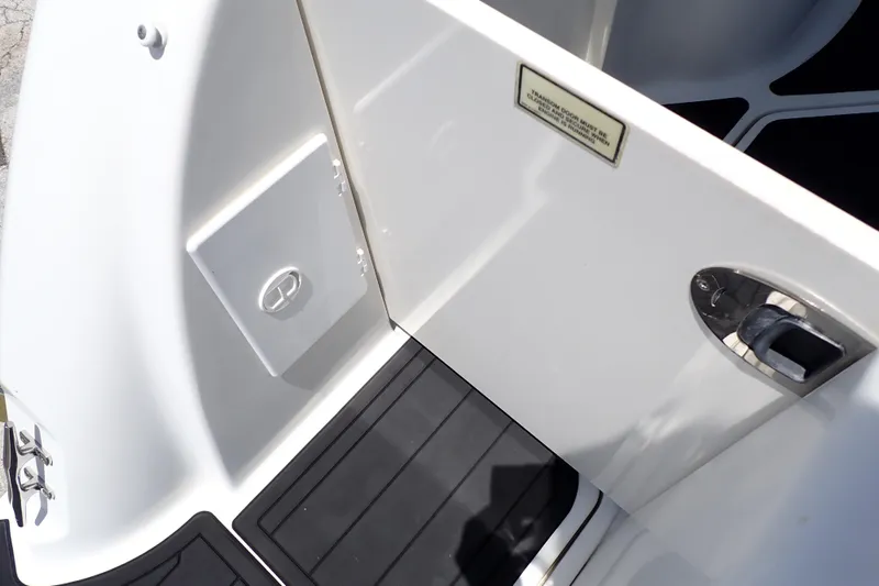 Slide: The Image of 2005 Sea Ray Sundancer 260 boat interior with open hatch and sleek design. - 30