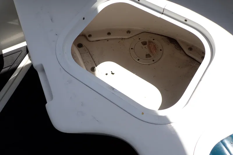 Slide: The Image of Storage compartment on a 2005 Sea Ray Sundancer 260 boat, showing interior details. - 34