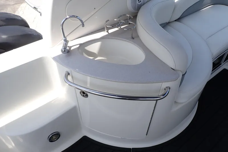 Slide: The Image of 2005 Sea Ray Sundancer 260 boat interior with sink and seating area. - 35