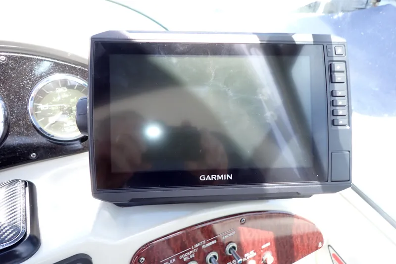 Slide: The Image of Garmin GPS device on 2005 Sea Ray Sundancer 260 dashboard with gauges and controls. - 41