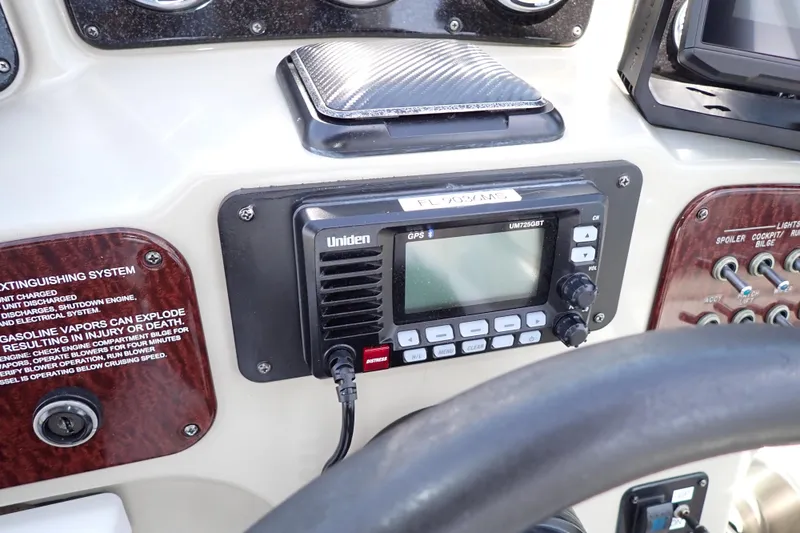 Slide: The Image of Control panel of a 2005 Sea Ray Sundancer 260 with Uniden marine radio. - 44