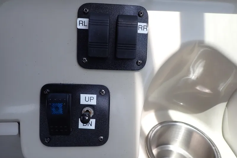 Slide: The Image of Control panel of a 2005 Sea Ray Sundancer 260 boat with labeled switches. - 46