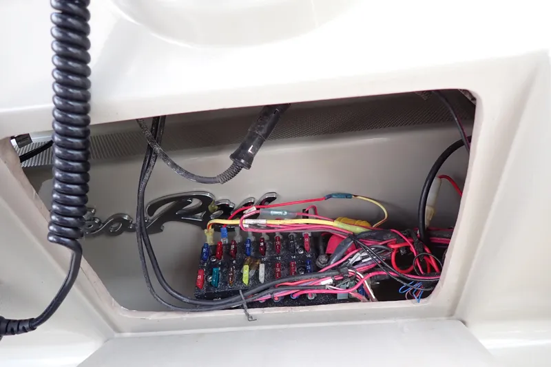 Slide: The Image of Electrical wiring and fuse panel inside a 2005 Sea Ray Sundancer 260 boat. - 50
