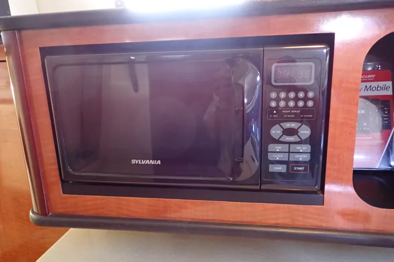 Slide: The Image of Sylvania microwave in 2005 Sea Ray Sundancer 260 boat interior. - 59