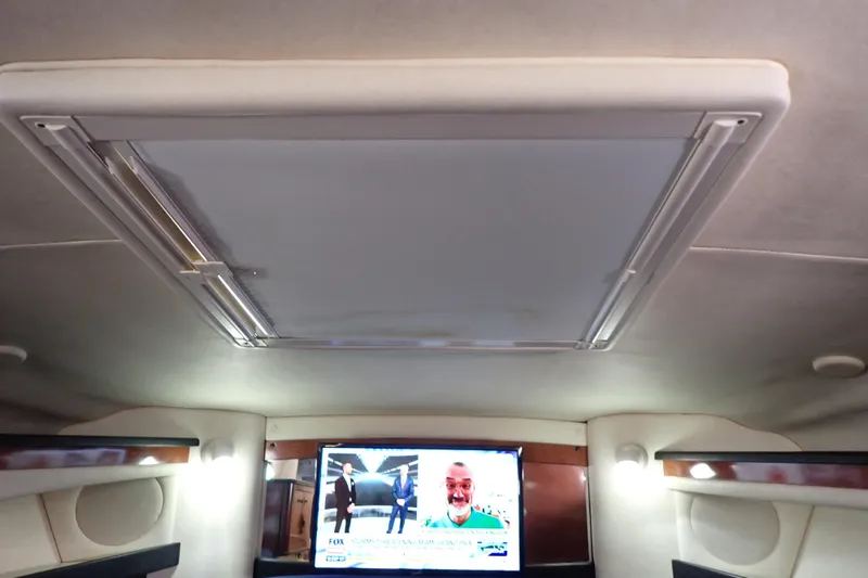 Slide: The Image of Interior of 2005 Sea Ray Sundancer 260 with TV and ceiling hatch. - 71