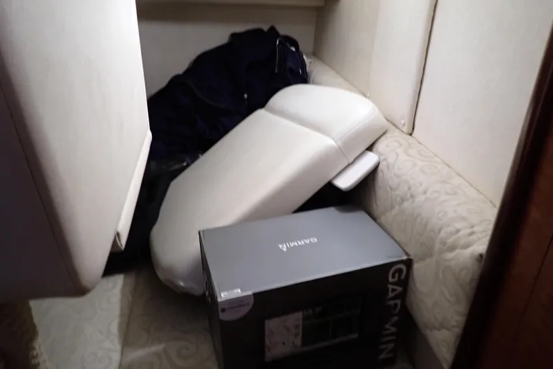 Slide: The Image of Interior of 2005 Sea Ray Sundancer 260 with Garmin box and cushions. - 88