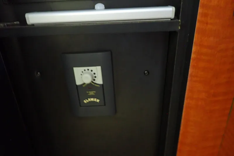 Slide: The Image of Glomex control panel inside 2005 Sea Ray Sundancer 260 boat interior. - 94