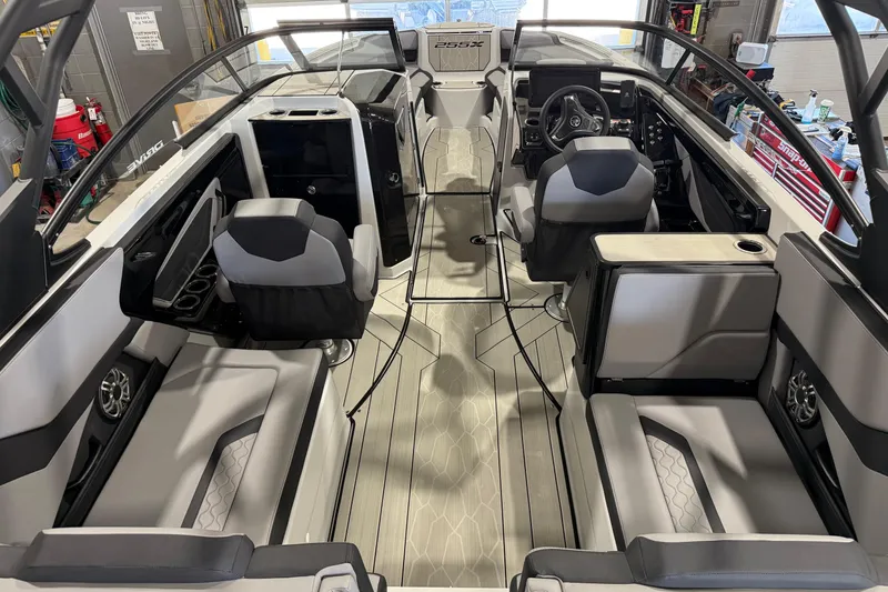 Slide: The Image of Interior of 2025 Yamaha Boats 255XD, featuring sleek seating and modern dashboard design. - 10