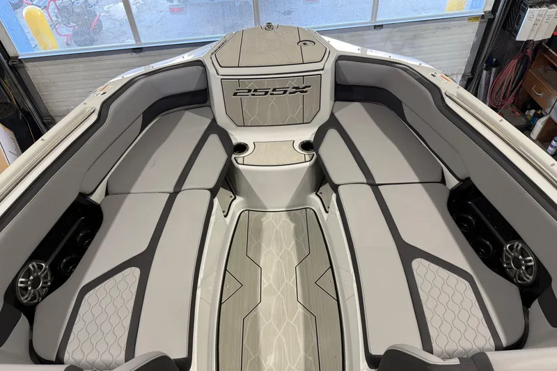 Slide: The Image of 2025 Yamaha Boats 255XD interior with sleek gray seating and modern design. - 14