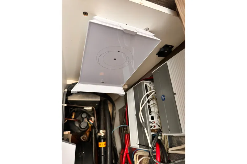 Slide: The Image of Electrical components inside a 2020 Azimut Verve 40 yacht, showcasing wiring and equipment. - 21