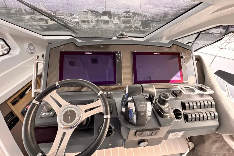 Slide: The Image of Cockpit of 2020 Azimut Verve 40 yacht with dual Simrad displays and modern controls. - 29