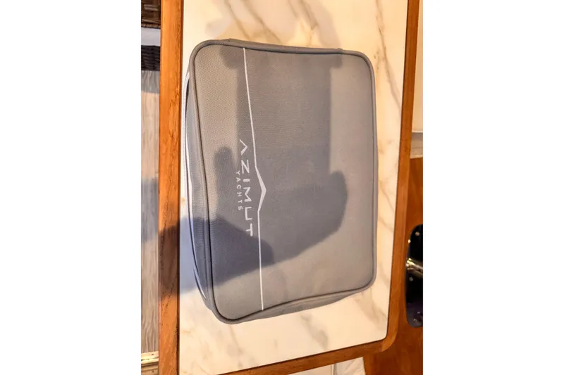 Slide: The Image of Gray Azimut Yachts bag on a marble and wood surface, 2020 Verve 40 model. - 35