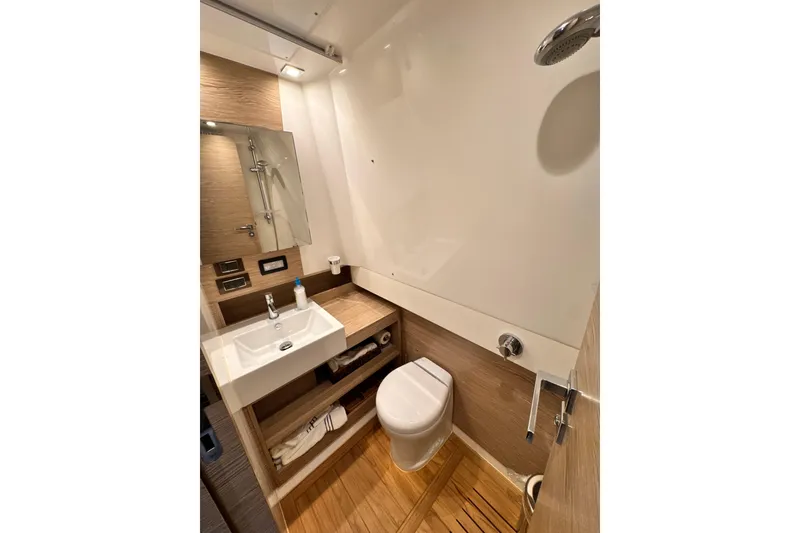 Slide: The Image of Luxurious bathroom interior of 2020 Azimut Verve 40 yacht, featuring modern fixtures and wooden accents. - 40