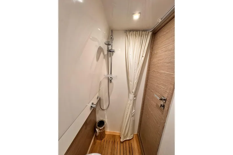 Slide: The Image of Shower area in 2020 Azimut Verve 40 yacht with wooden flooring and curtain. - 41