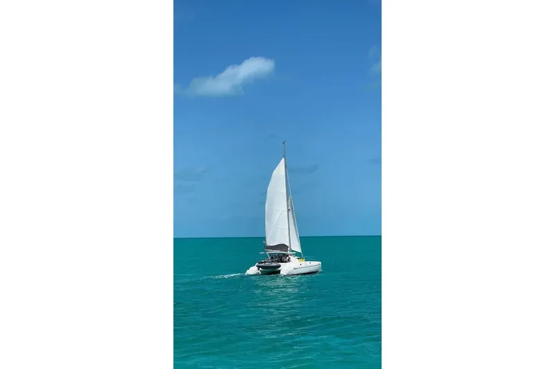 The Image of Sailing catamaran Fountaine Pajot Athena 38, 1995, on turquoise ocean waters. - 0