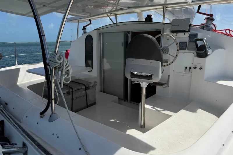Slide: The Image of Cockpit of 1995 Fountaine Pajot Athena 38 catamaran with steering wheel and navigation equipment. - 12