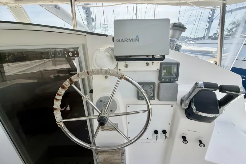 Slide: The Image of Helm of 1995 Fountaine Pajot Athena 38 catamaran with Garmin navigation system. - 13