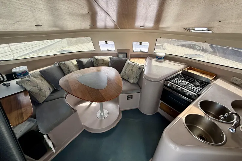 Slide: The Image of Interior of 1995 Fountaine Pajot Athena 38 catamaran with kitchen and seating area. - 16