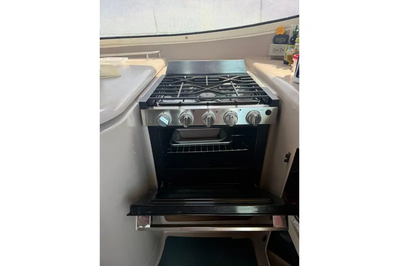 Slide: The Image of Stainless steel stove and oven in 1995 Fountaine Pajot Athena 38 yacht kitchen. - 20