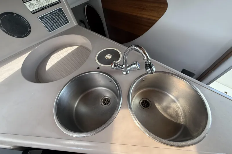 Slide: The Image of Stainless steel double sink in 1995 Fountaine Pajot Athena 38 catamaran kitchen. - 21