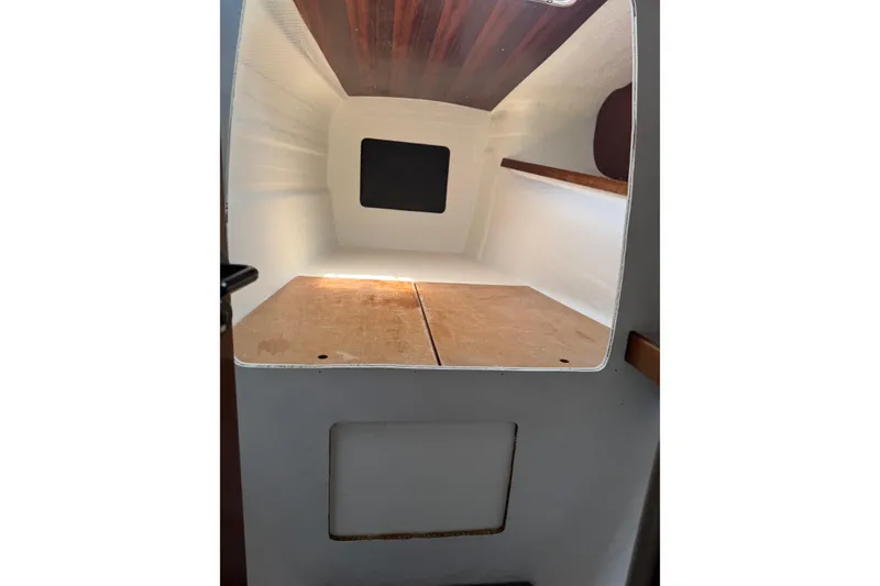 Slide: The Image of Interior cabin view of a 1995 Fountaine Pajot Athena 38 catamaran, featuring wooden accents. - 24