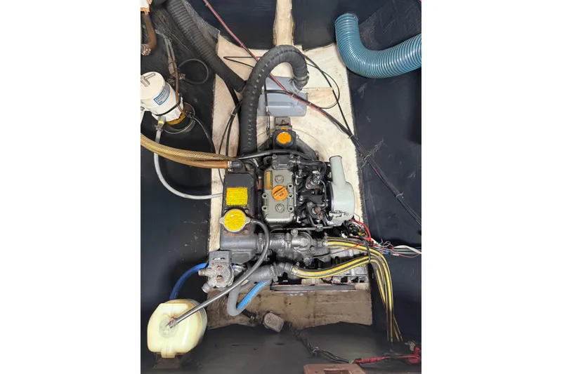 Slide: The Image of Engine compartment of a 1995 Fountaine Pajot Athena 38 catamaran, showcasing mechanical components. - 36
