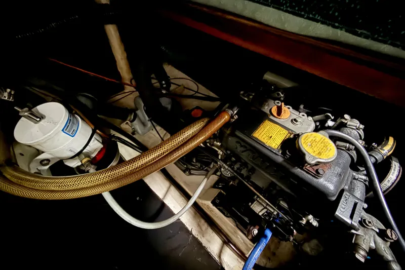 Slide: The Image of Engine compartment of 1995 Fountaine Pajot Athena 38 catamaran, showcasing mechanical components. - 37