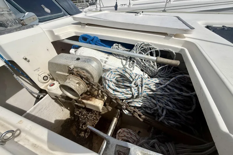 Slide: The Image of Anchor locker of 1995 Fountaine Pajot Athena 38 with ropes and chains. - 39