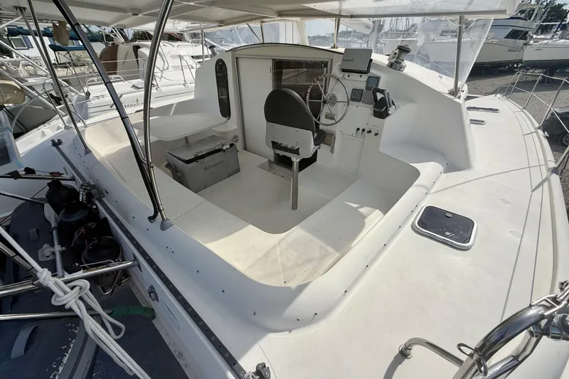 Slide: The Image of 1995 Fountaine Pajot Athena 38 catamaran cockpit with steering wheel and navigation equipment. - 4