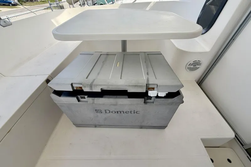Slide: The Image of Dometic cooler on Fountaine Pajot Athena 38 catamaran, 1995 model, with white table above. - 40