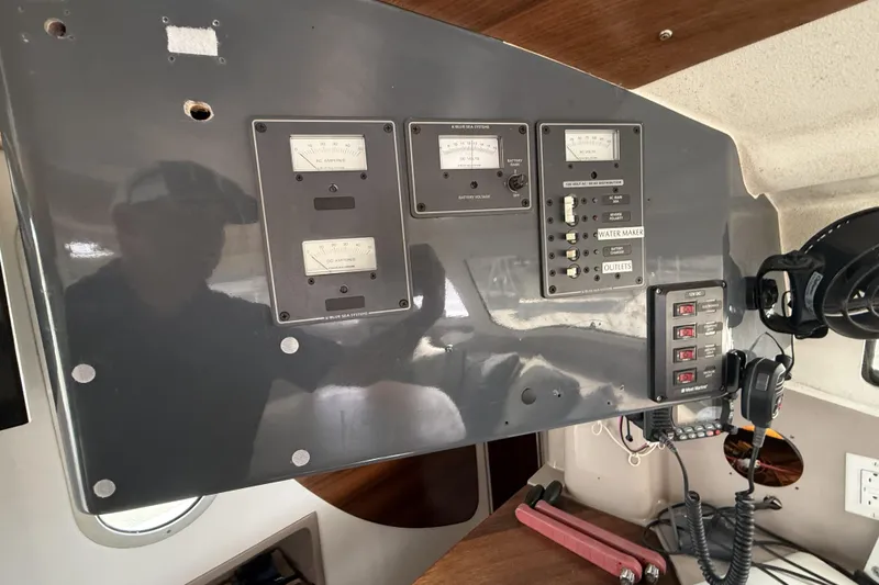 Slide: The Image of Control panel of a 1995 Fountaine Pajot Athena 38 catamaran with gauges and switches. - 41