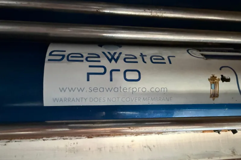 Slide: The Image of SeaWater Pro label on a Fountaine Pajot Athena 38, 1995 model. Warranty excludes membrane. - 43