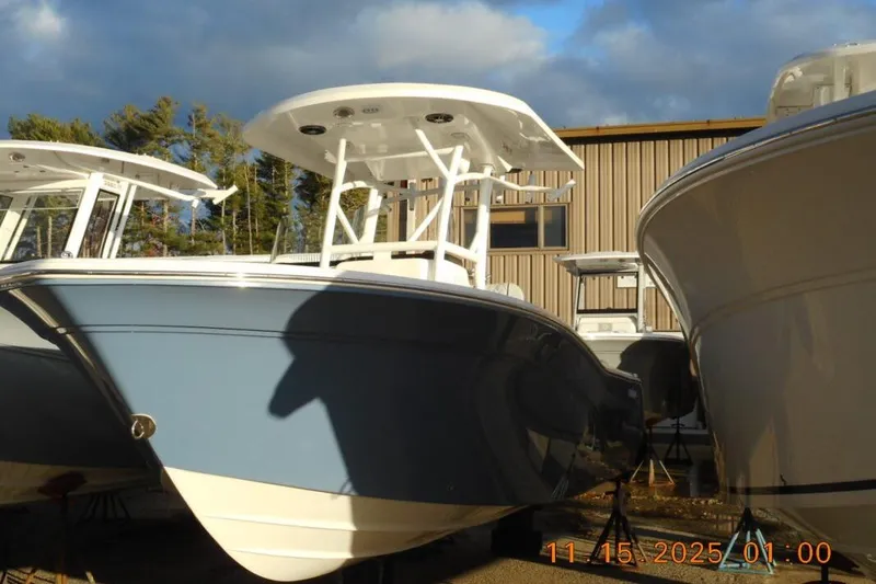 The Image of 2026 Sea Fox 248 Side Console boat displayed outdoors under a cloudy sky. - 1