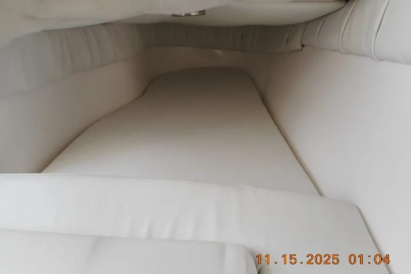Slide: The Image of Interior cabin of 2026 Sea Fox 248 Side Console boat, featuring white cushioned seating. - 12