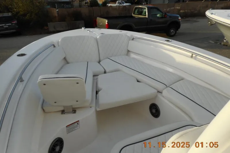 Slide: The Image of 2026 Sea Fox 248 Side Console boat with spacious seating area and white upholstery. - 13