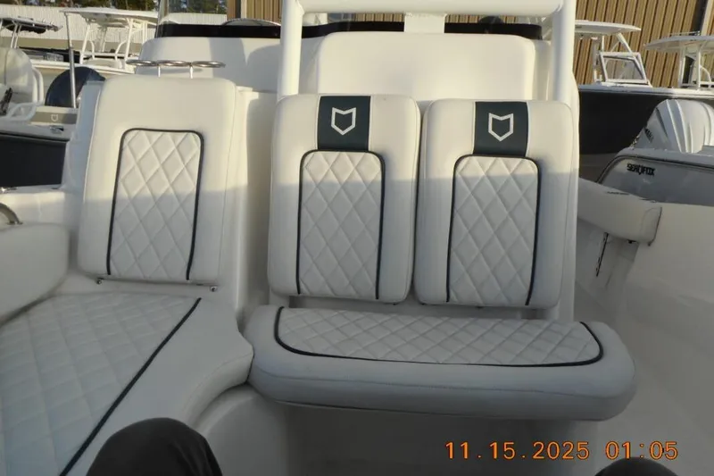 Slide: The Image of 2026 Sea Fox 248 Side Console boat with luxurious white seating and quilted design. - 14